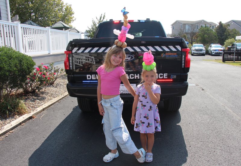 Sporting elaborate balloon headbands are Kennedy Schaeffer, left, and Addie Decktor.
